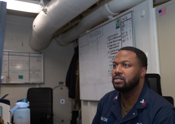 USS Ronald Reagan (CVN 76) Sailors process administrative documents