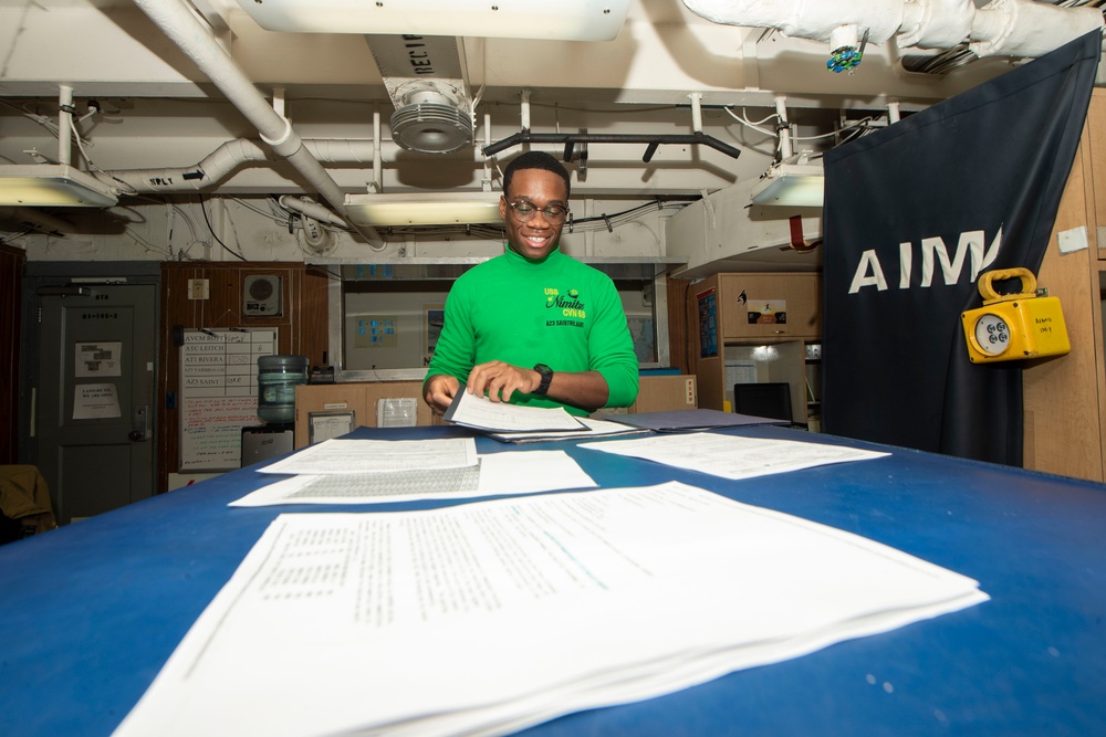 U.S. Navy Sailor Prepares Correspondences