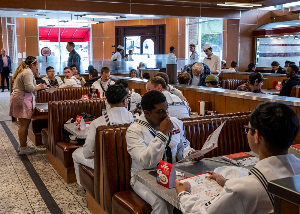 Sailors eat lunch at Ruby's Diner