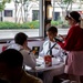 Sailors eat lunch at Ruby's Diner