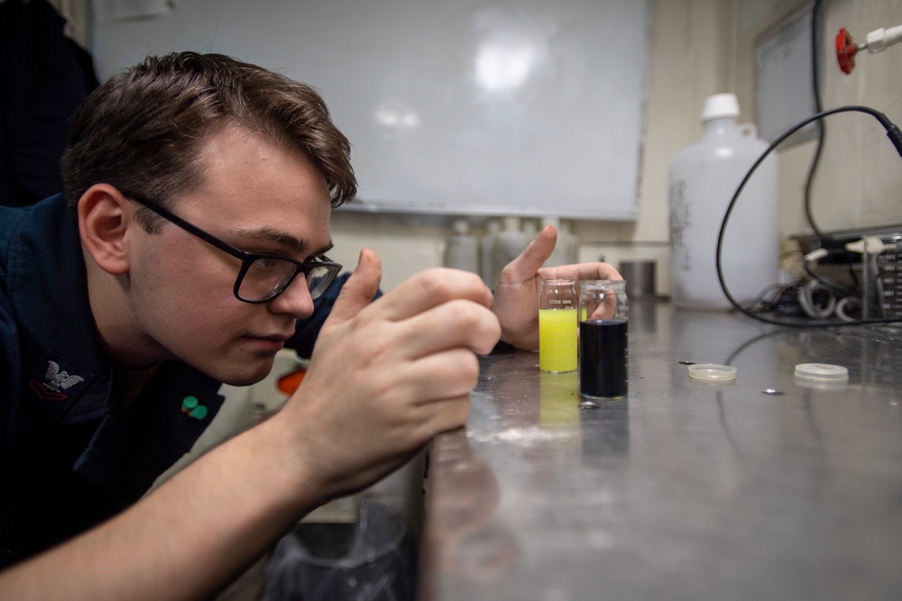 U.S. Navy Sailor Conducts Analysis