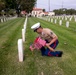 Sailors and Marine place flag at service members graves