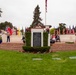 Sailors and Marine place flag at service members graves