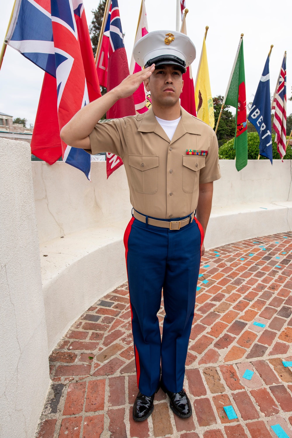 Sailors and Marine place flag at service members graves