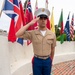 Sailors and Marine place flag at service members graves