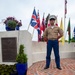 Sailors and Marine place flag at service members graves