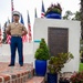 Sailors and Marine place flag at service members graves