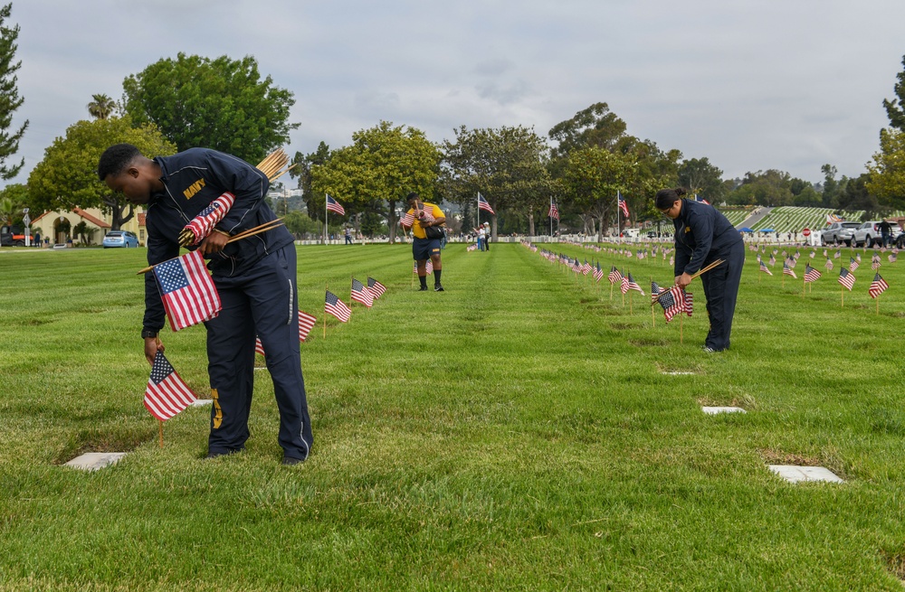 Sailors Place Flags on Service Member's Graves