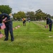 Sailors Place Flags on Service Member's Graves