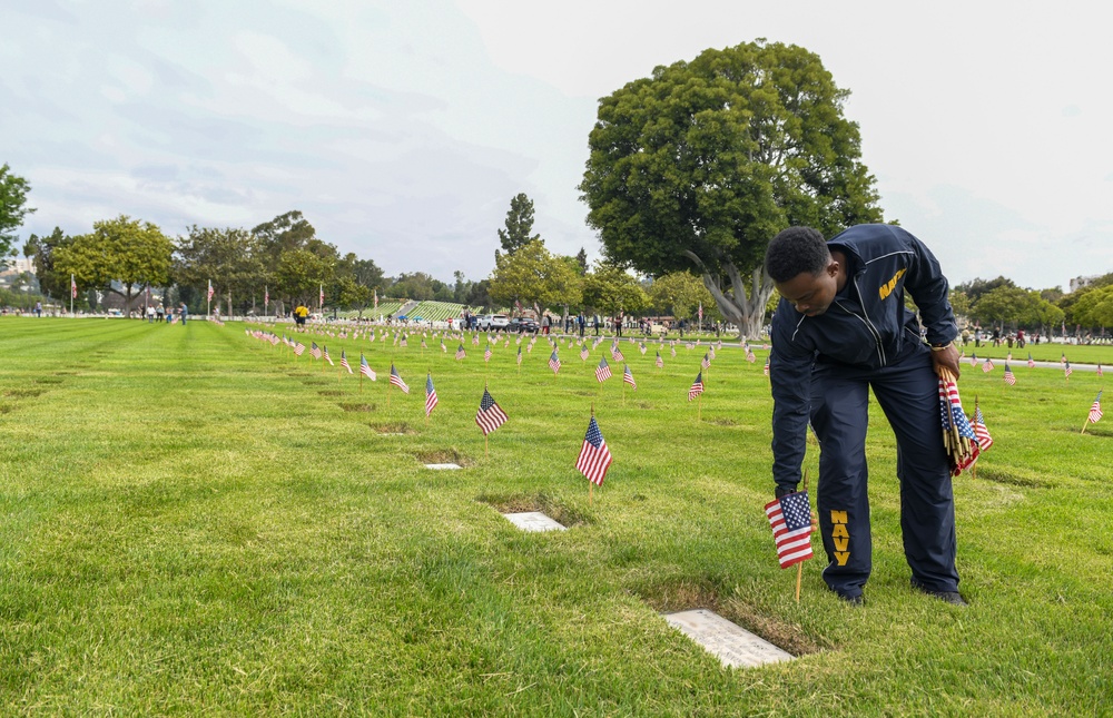 Sailors Place Flags on Service Member's Graves