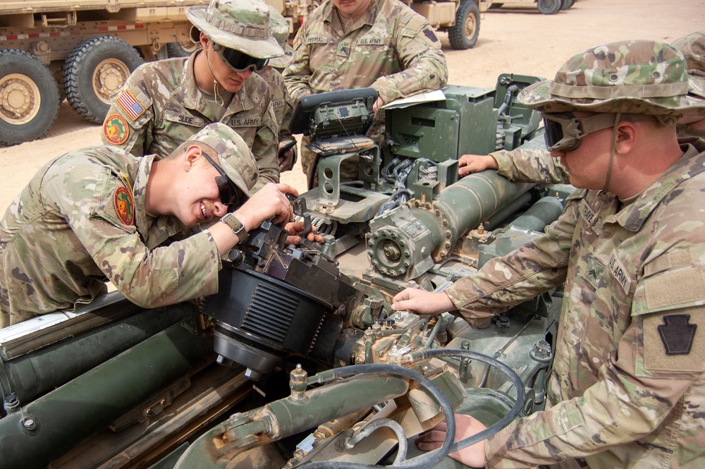 Soldiers performing maintenance.