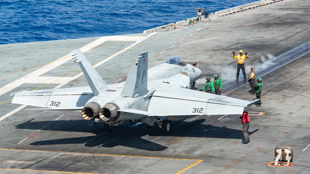 Sailor Directs Aircraft On The Flight Deck