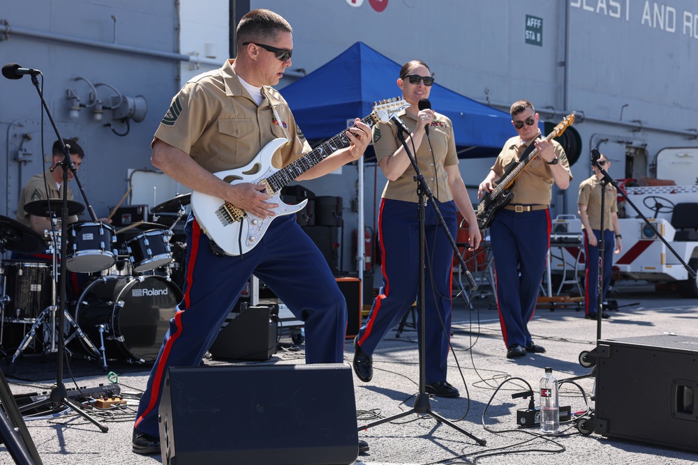 Quantico Marine Rock Band performs aboard the USS WASP (LHD 1) during Fleet Week