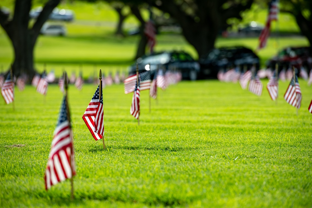 Boy Scouts place flags on unknown graves