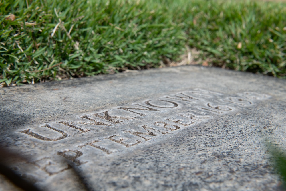 Boy Scouts place flags on unknown graves