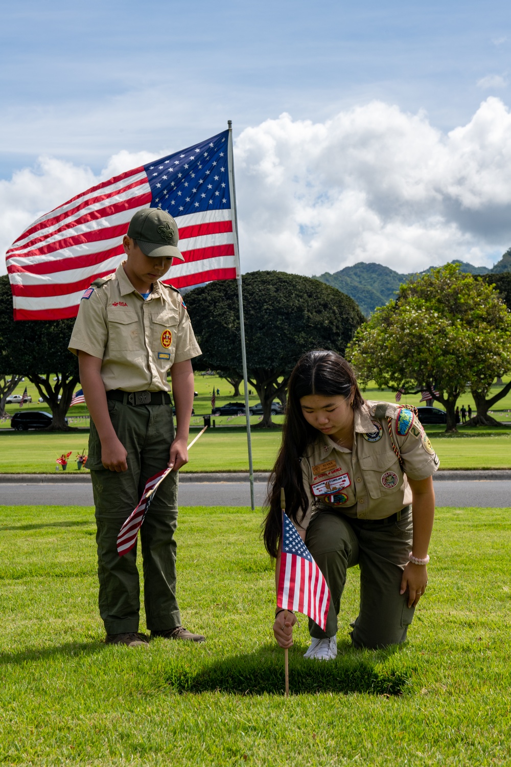 Boy Scouts place flags on unknown graves