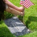 Boy Scouts place flags on unknown graves