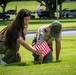 Boy Scouts place flags on unknown graves