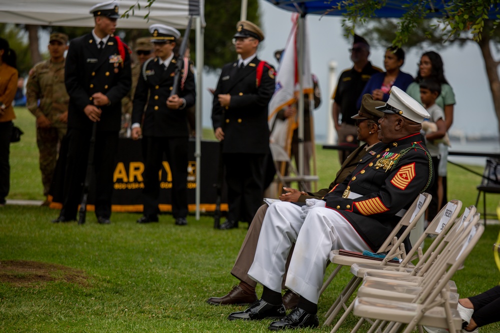 Service members attend the Sunset Sunset Ceremony at the Long Beach Navy Memorial during Los Angeles Fleet Week