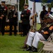 Service members attend the Sunset Sunset Ceremony at the Long Beach Navy Memorial during Los Angeles Fleet Week