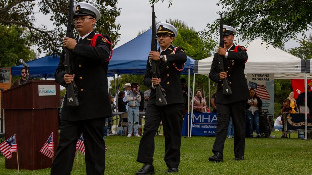 Service members attend the Sunset Sunset Ceremony at the Long Beach Navy Memorial during Los Angeles Fleet Week