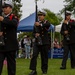 Service members attend the Sunset Sunset Ceremony at the Long Beach Navy Memorial during Los Angeles Fleet Week