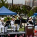 Service members attend the Sunset Sunset Ceremony at the Long Beach Navy Memorial during Los Angeles Fleet Week