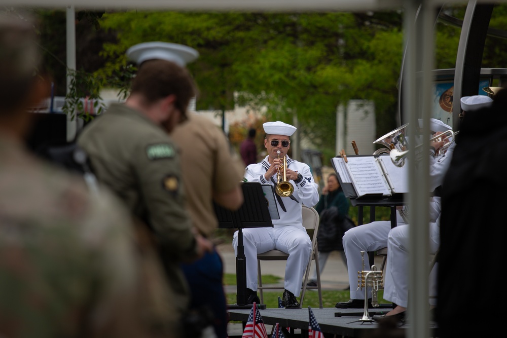 Service members attend the Sunset Sunset Ceremony at the Long Beach Navy Memorial during Los Angeles Fleet Week