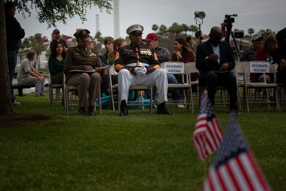 Service members attend the Sunset Sunset Ceremony at the Long Beach Navy Memorial during Los Angeles Fleet Week