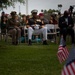 Service members attend the Sunset Sunset Ceremony at the Long Beach Navy Memorial during Los Angeles Fleet Week