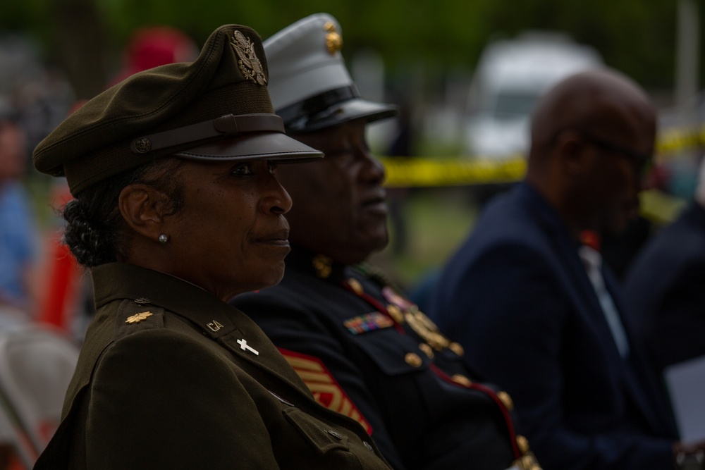 Service members attend the Sunset Sunset Ceremony at the Long Beach Navy Memorial during Los Angeles Fleet Week