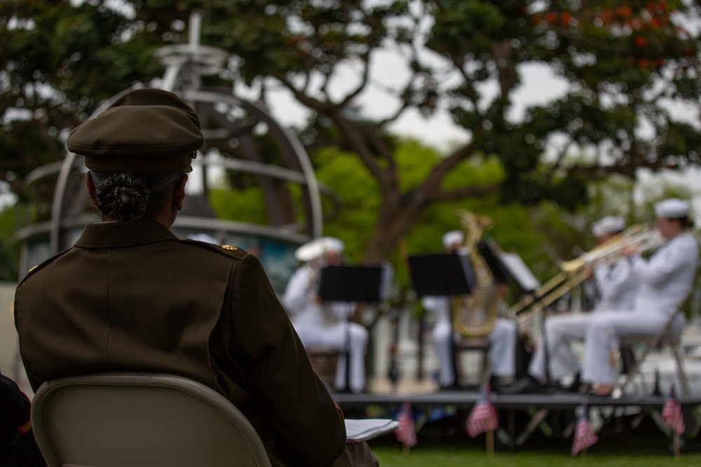 Service members attend the Sunset Sunset Ceremony at the Long Beach Navy Memorial during Los Angeles Fleet Week