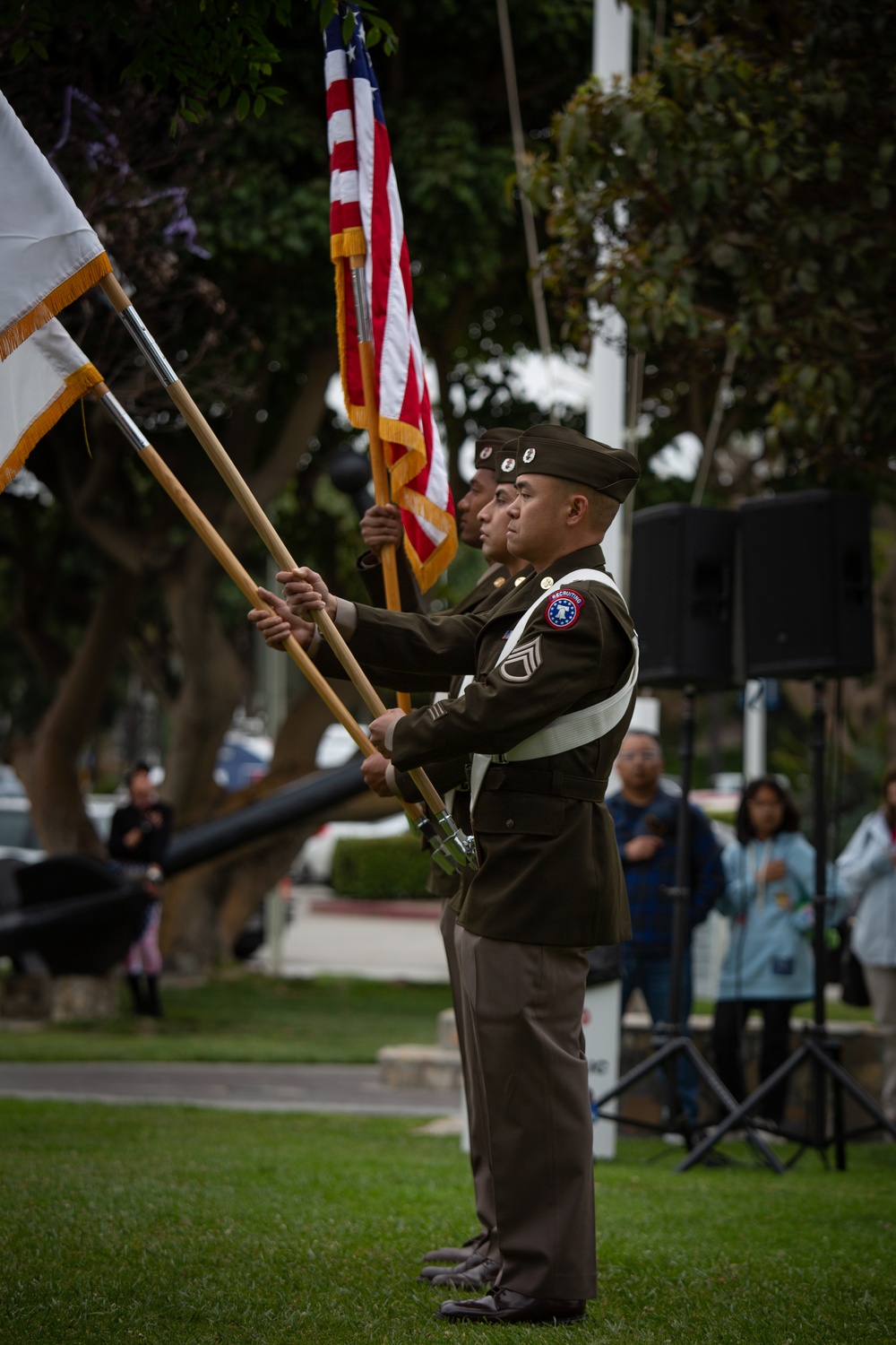 Service members attend the Sunset Sunset Ceremony at the Long Beach Navy Memorial during Los Angeles Fleet Week