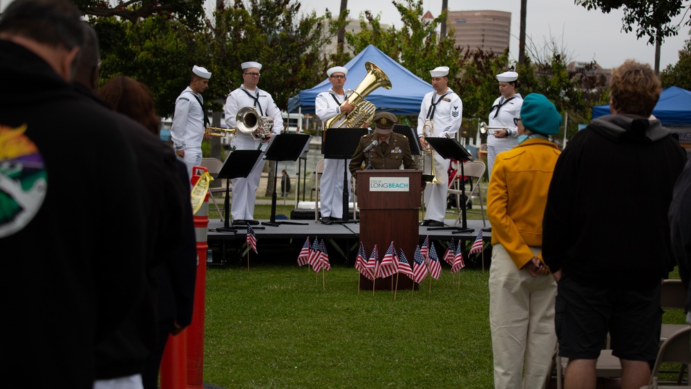 Service members attend the Sunset Sunset Ceremony at the Long Beach Navy Memorial during Los Angeles Fleet Week