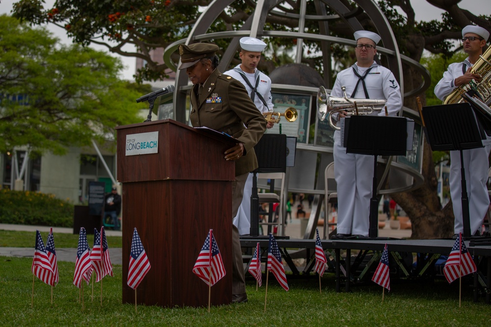 Service members attend the Sunset Sunset Ceremony at the Long Beach Navy Memorial during Los Angeles Fleet Week