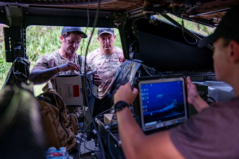 Sailors assigned to NMCB1 and SRT1 Work to Clear Fuel Depot Roads Following Typhoon Mawar