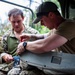 Sailors assigned to NMCB1 and SRT1 Work to Clear Fuel Depot Roads Following Typhoon Mawar