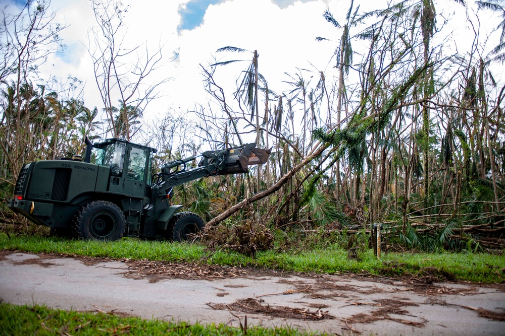 Sailors assigned to NMCB1 and SRT1 Work to Clear Fuel Depot Roads Following Typhoon Mawar