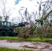 Sailors assigned to NMCB1 and SRT1 Work to Clear Fuel Depot Roads Following Typhoon Mawar