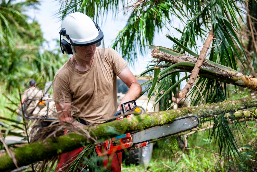 Sailors assigned to NMCB1 and SRT1 Work to Clear Fuel Depot Roads Following Typhoon Mawar