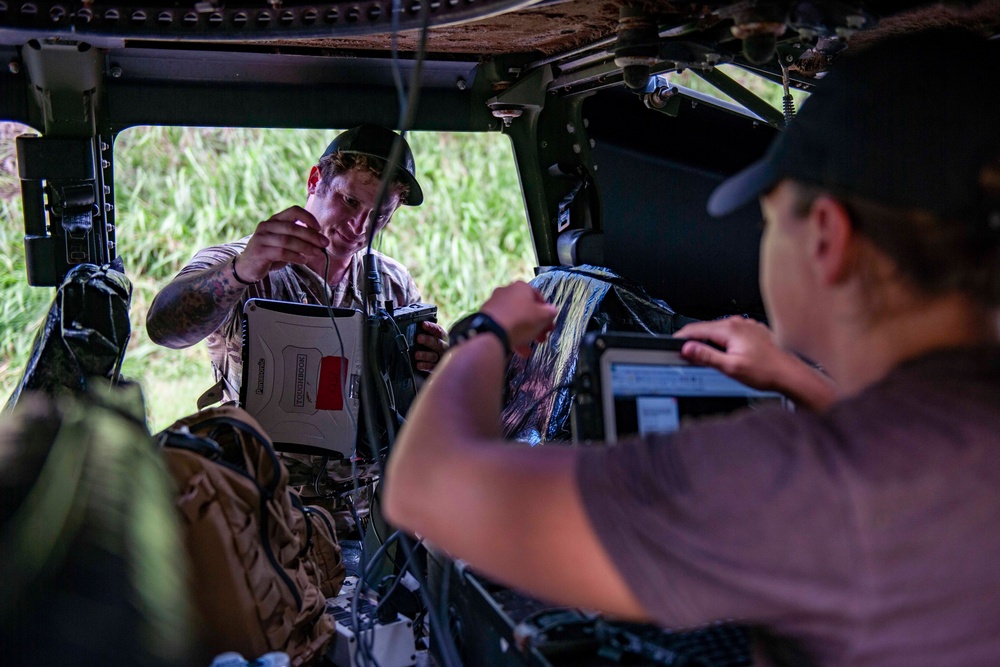 Sailors assigned to NMCB1 and SRT1 Work to Clear Fuel Depot Roads Following Typhoon Mawar