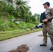 Sailors assigned to NMCB1 and SRT1 Work to Clear Fuel Depot Roads Following Typhoon Mawar