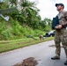 Sailors assigned to NMCB1 and SRT1 Work to Clear Fuel Depot Roads Following Typhoon Mawar