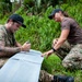 Sailors assigned to NMCB1 and SRT1 Work to Clear Fuel Depot Roads Following Typhoon Mawar