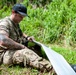 Sailors assigned to NMCB1 and SRT1 Work to Clear Fuel Depot Roads Following Typhoon Mawar