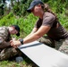 Sailors assigned to NMCB1 and SRT1 Work to Clear Fuel Depot Roads Following Typhoon Mawar