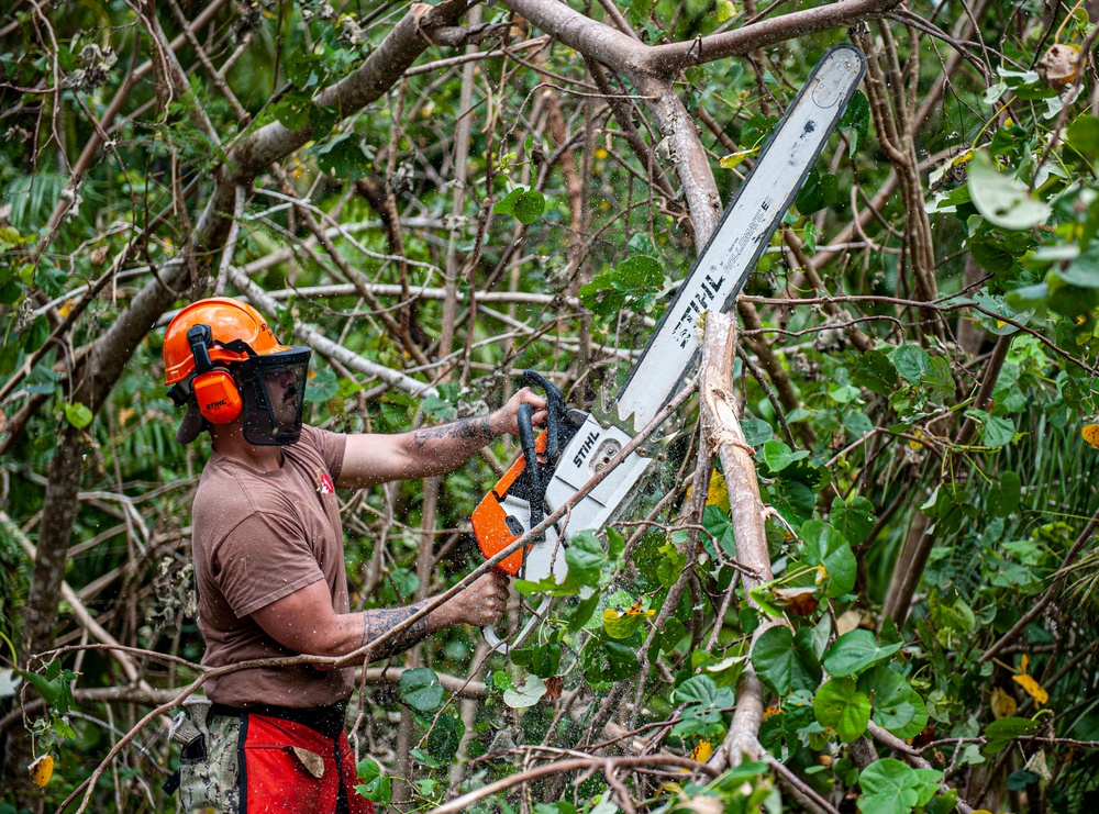 Sailors assigned to NMCB1 and SRT1 Work to Clear Fuel Depot Roads Following Typhoon Mawar