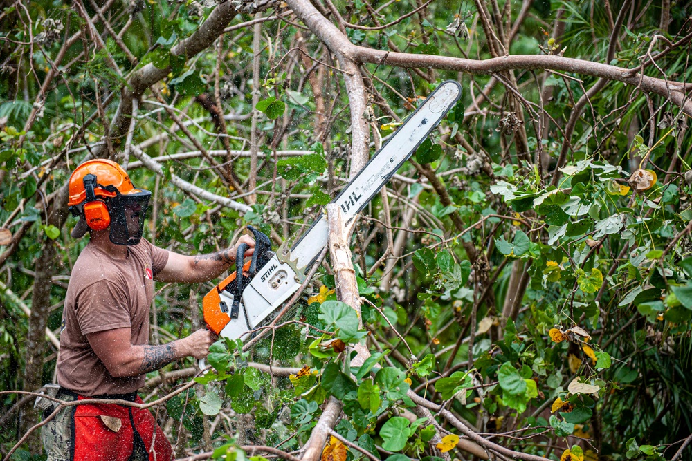 Sailors assigned to NMCB1 and SRT1 Work to Clear Fuel Depot Roads Following Typhoon Mawar