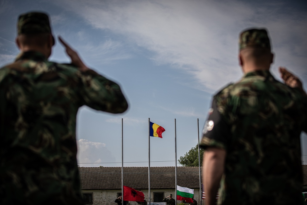 The Romanian flag is raised during the Saber Guardian opening ceremony