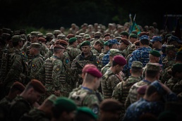 Romanian military service members mass during opening ceremony of Saber Guardian